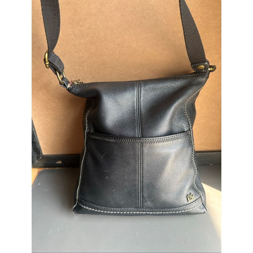 The Sak black pebble leather adjustable crossbody brass hardware